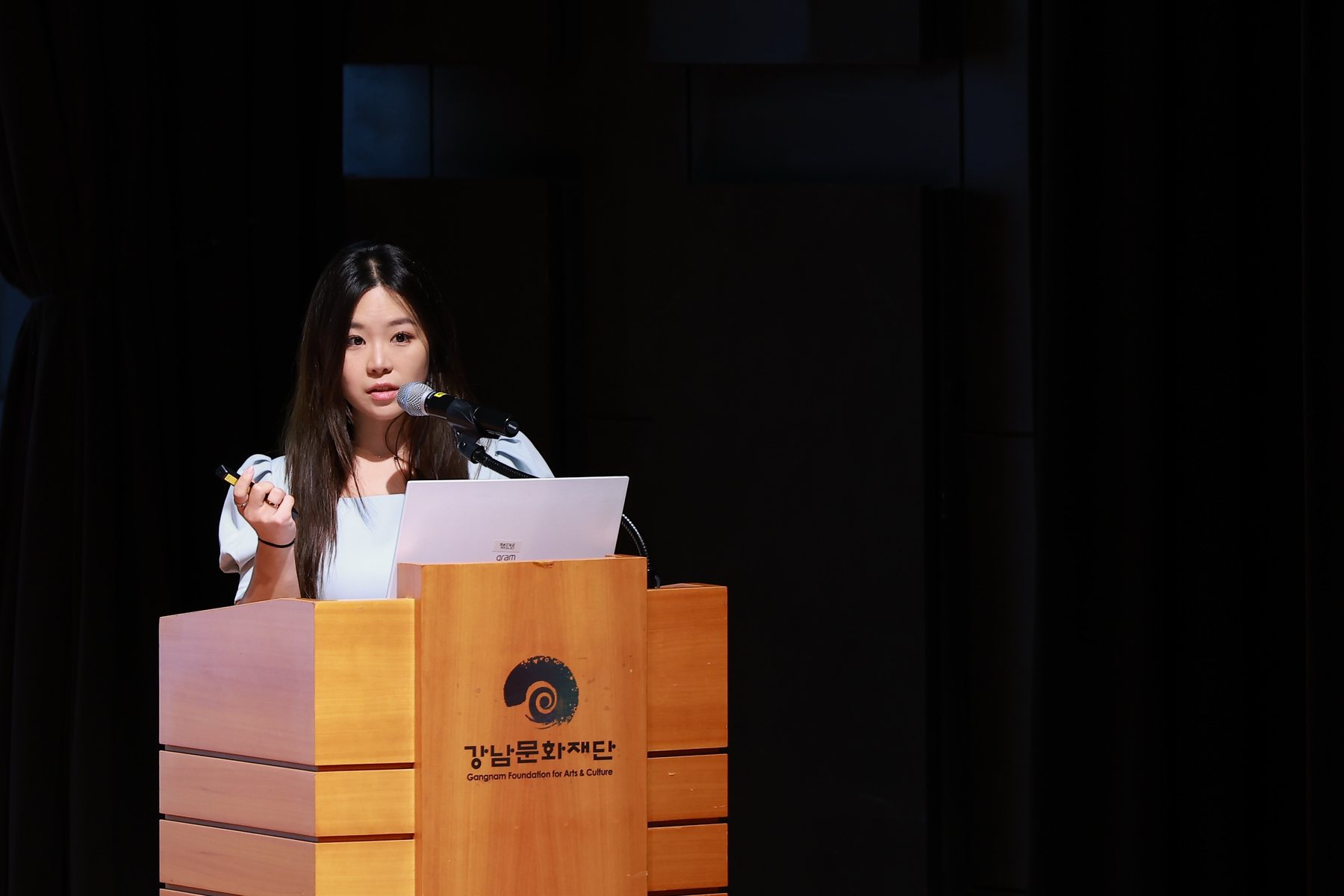 Marianne Lee speaking at an education seminar